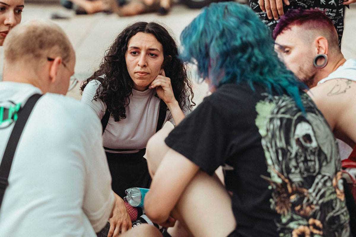 Group of young people sitting on the floor