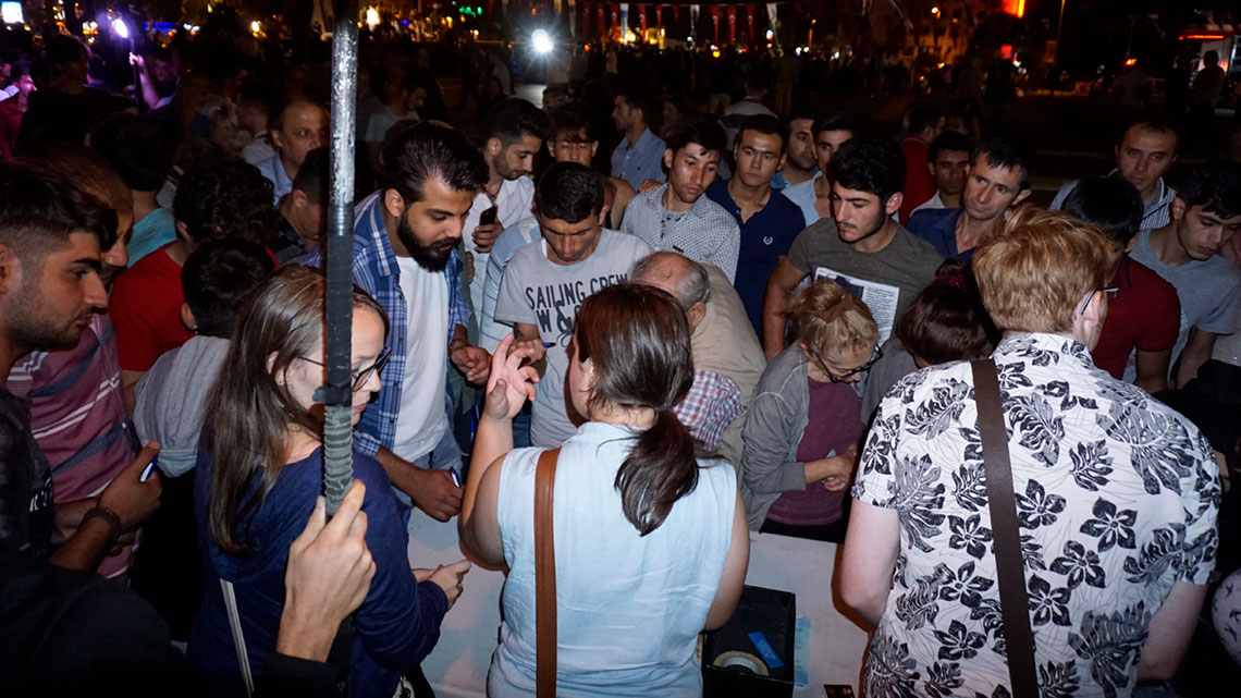 People filling out forms asking for more information about Jesus